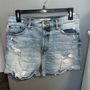 Ripped blue jean shorts